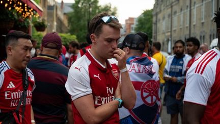 La déception des supporters d'Arsenal après la défaite en finale de la Ligue des champions face au PSG